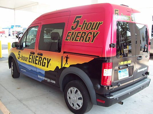 Van with 5-hour ENERGY branding on a full vehicle wrap parked in a lot