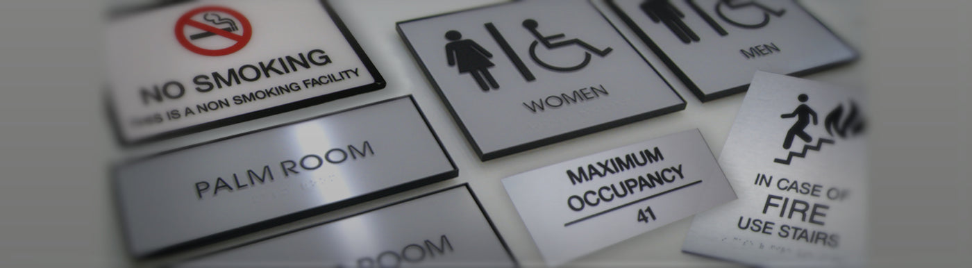 Collection of various ADA compliant signs