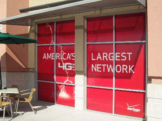 Red window display with 'America's Largest Network' text and Verizon logo.
