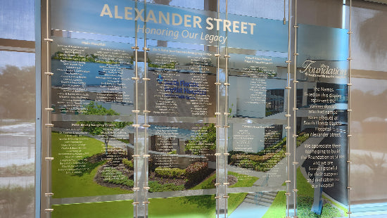 Acrylic recognition plaques in a metal pole system, with the text 'Alexander Street Honoring Our Legacy'