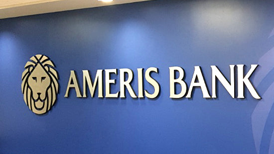 Ameris Bank aluminum letters and logo sign on a blue wall