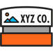 Icon of XYZ Co. with a stylized mountain and sun design on a monument sign