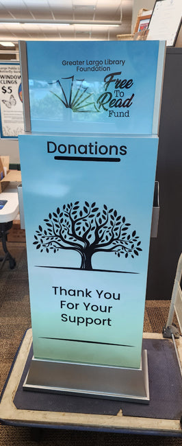 Donations box digital wrap with a tree graphic and text in a library setting