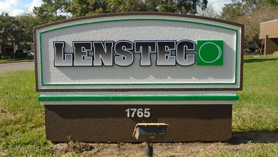 LensTec monument sign with address number 1765 on a grassy area