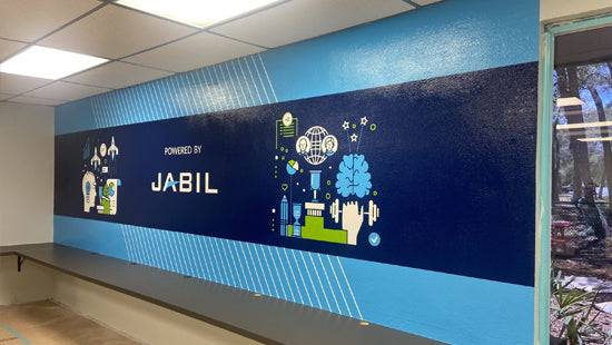 Wall mural with Jabil logo and branding in a modern office setting