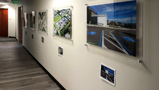 Corridor with posters printed on acrylic with metal standoffs