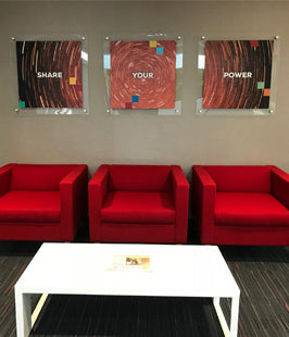 Motivational acrylic posters in a modern lobby