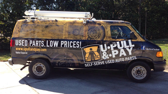 Full vehicle wrap with U-Pull & Pay branding on a yellow and black background on a cargo van