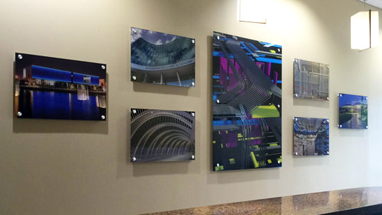 Set of acrylic posters with architectural designs on a wallpost