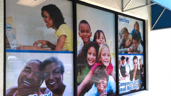 Collage of images on a window graphic showing people in various settings, including a classroom and office, with a focus on families and small businesses.